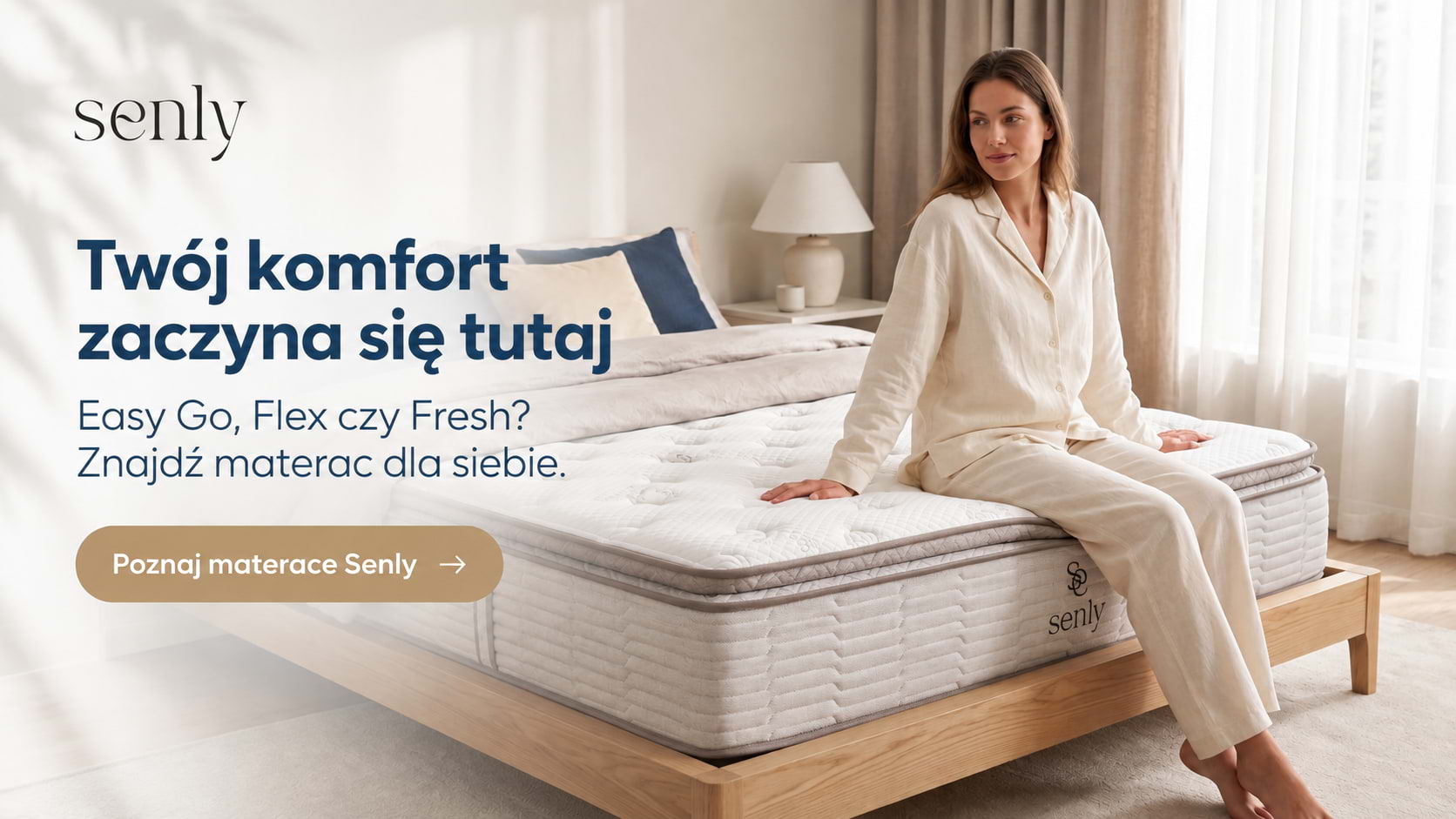 Kobieta siedząca na materacu kieszeniowym Fresh w minimalistycznej premium sypialni